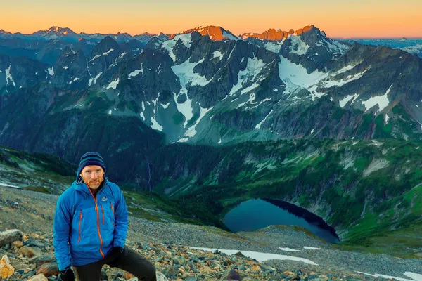 The sun rises over the North Cascade range in northwestern Washington while I stand at Sahale Glacier Camp.